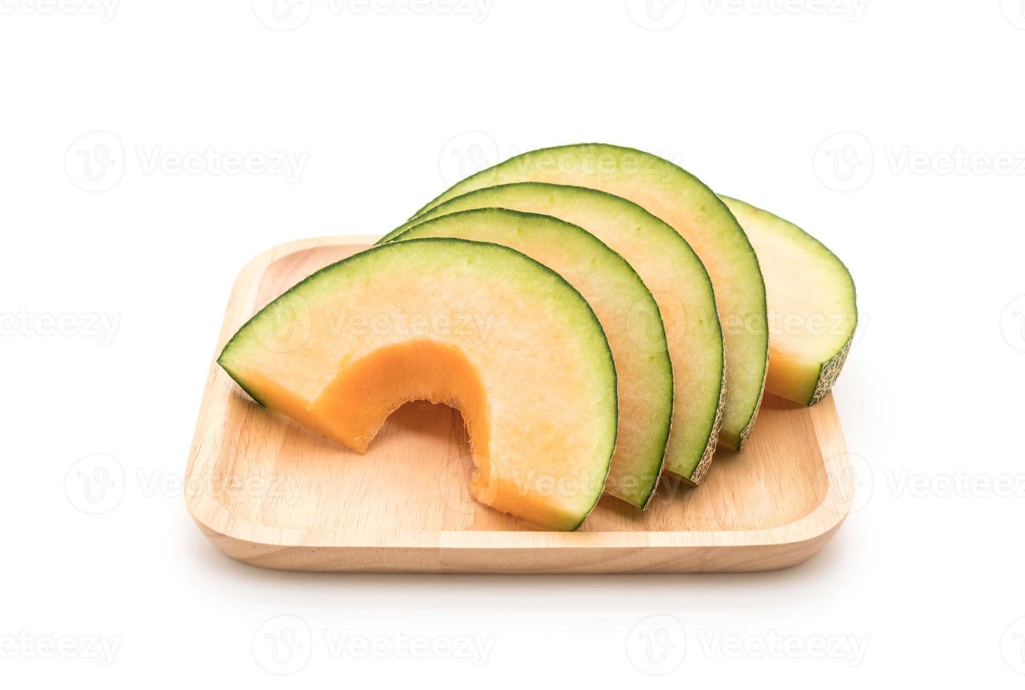 Melon cantaloup sur fond blanc photo