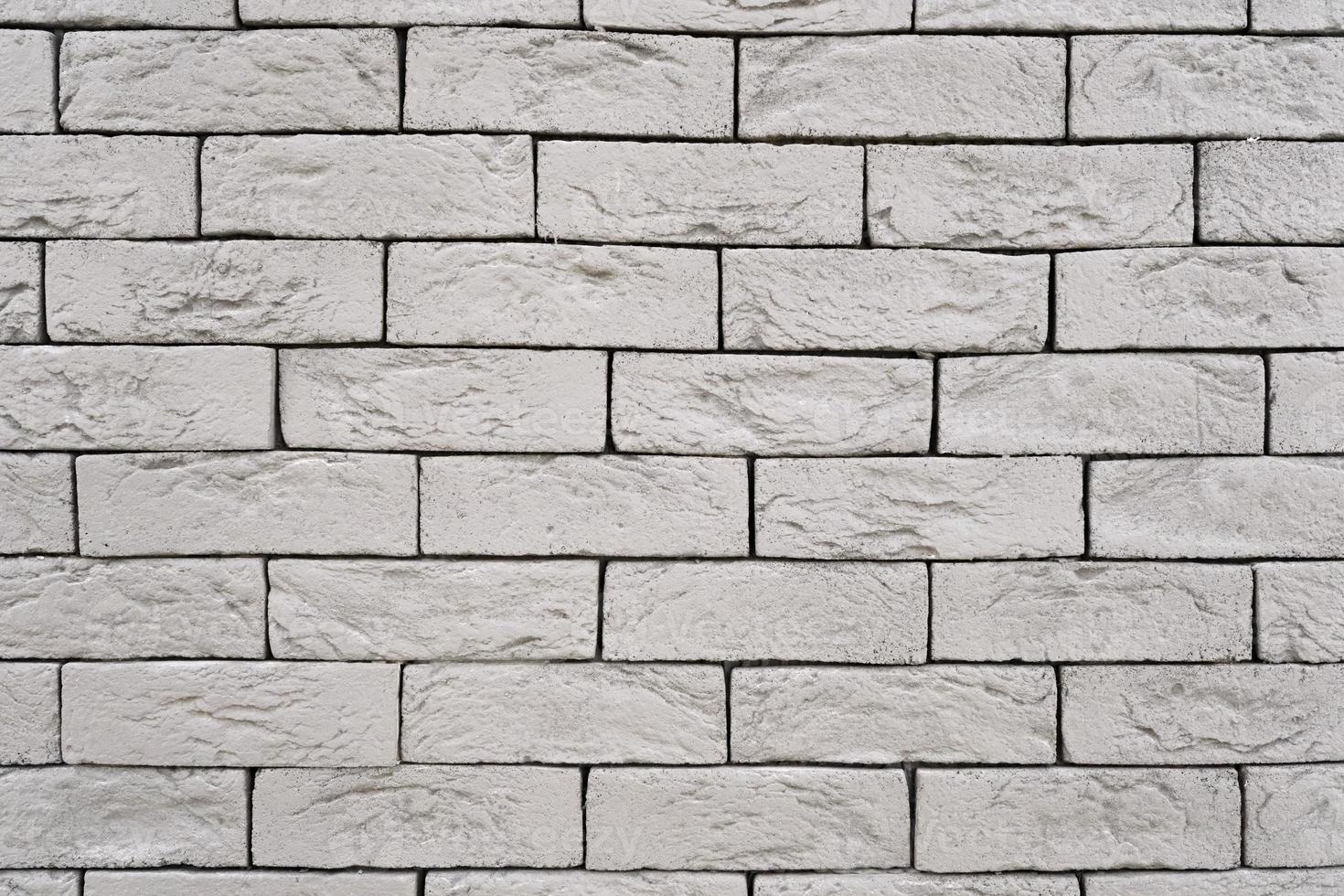 Mur de briques décoratives grises avec texture de gros plan isolé photo