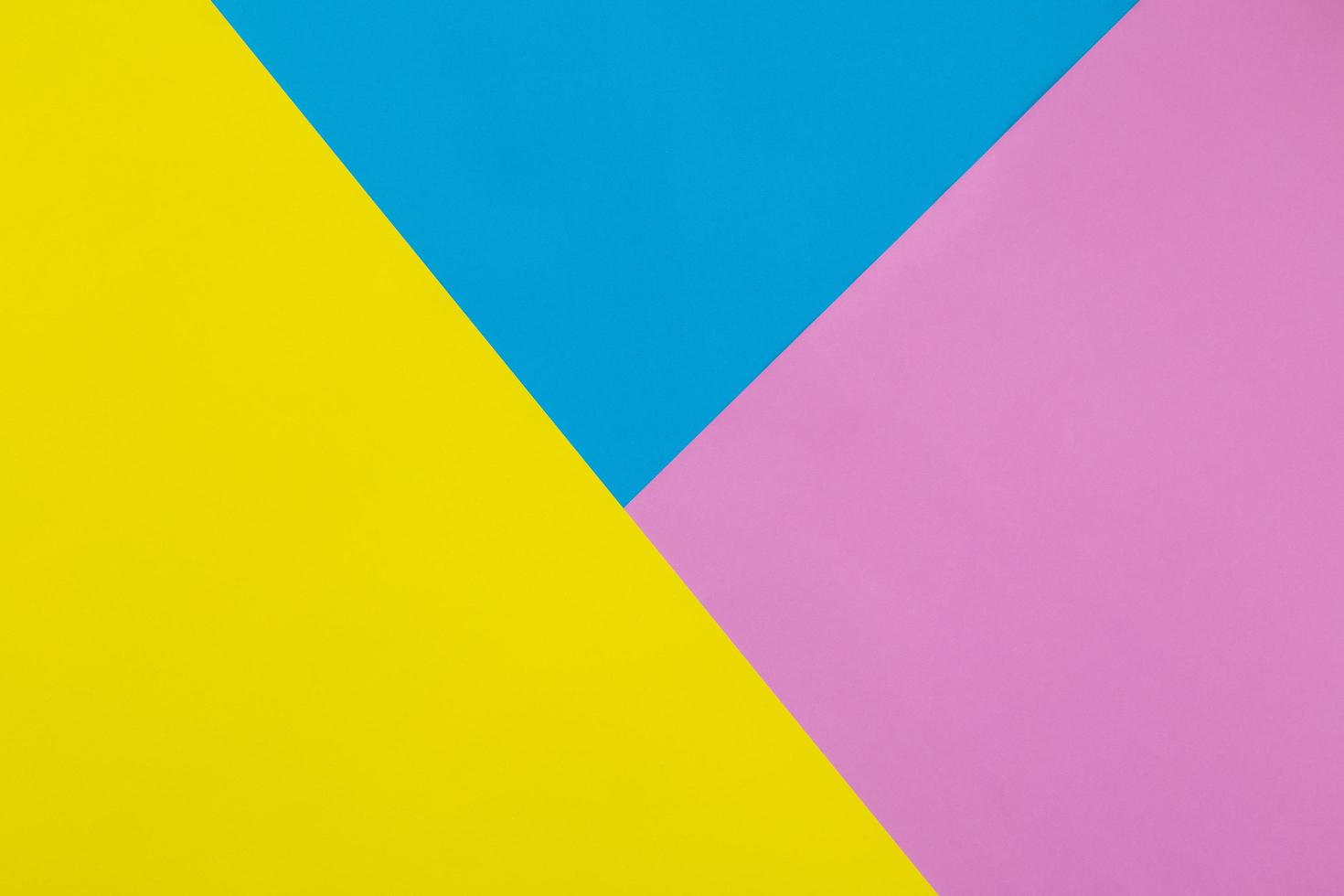 fond de texture de papier pastel jaune, bleu et rose coloré photo