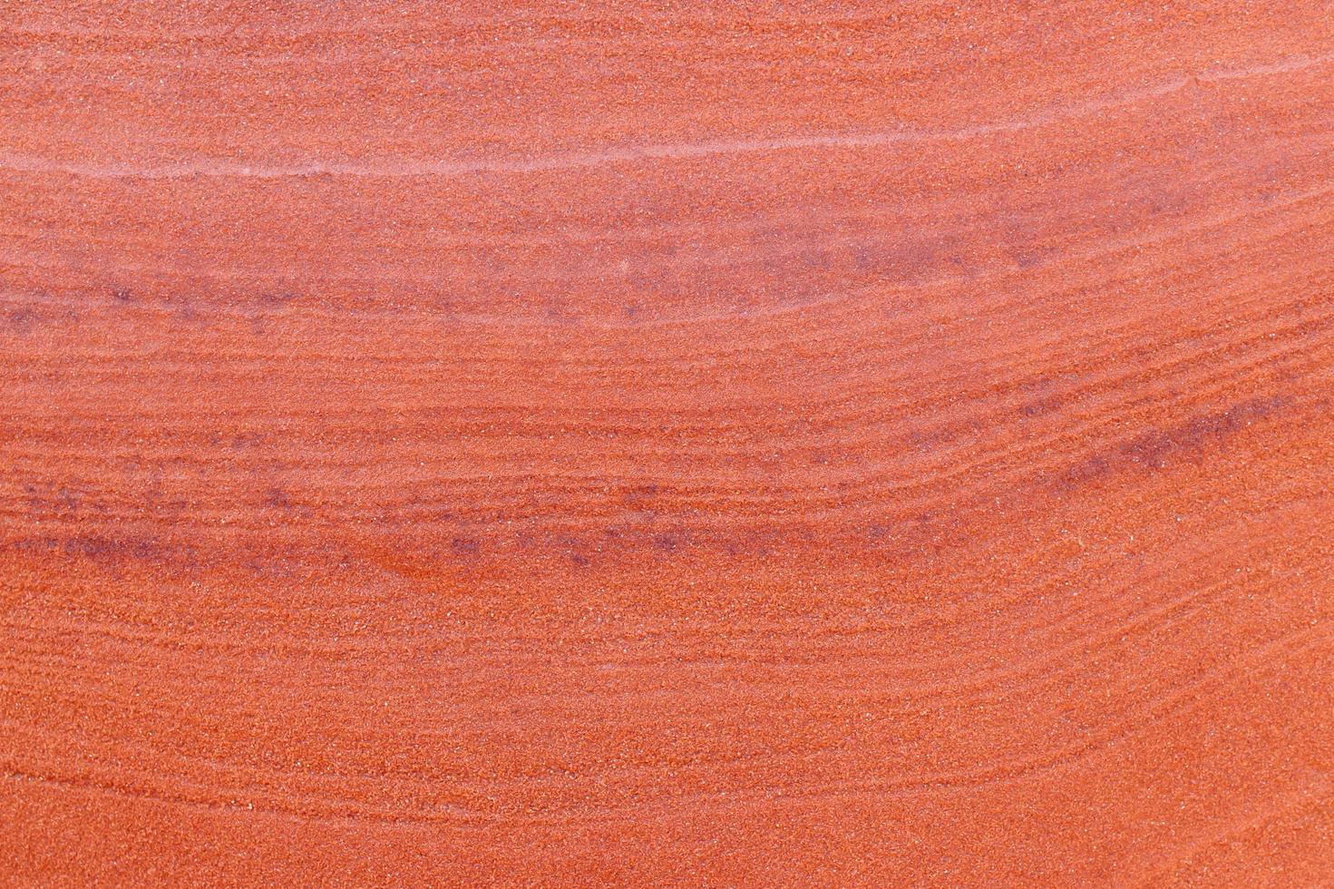 fond de texture de pierre rugueuse rouge. photo