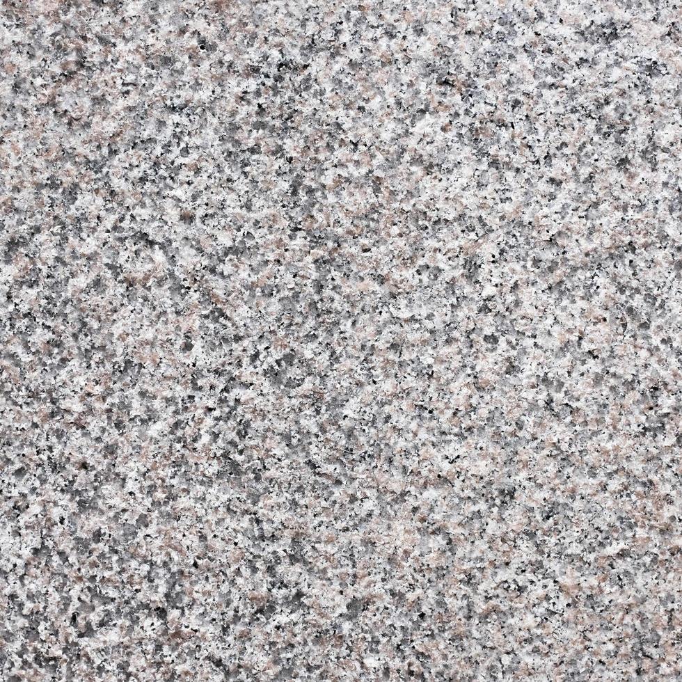 texture de pierre de granit gris foncé sans couture. photo