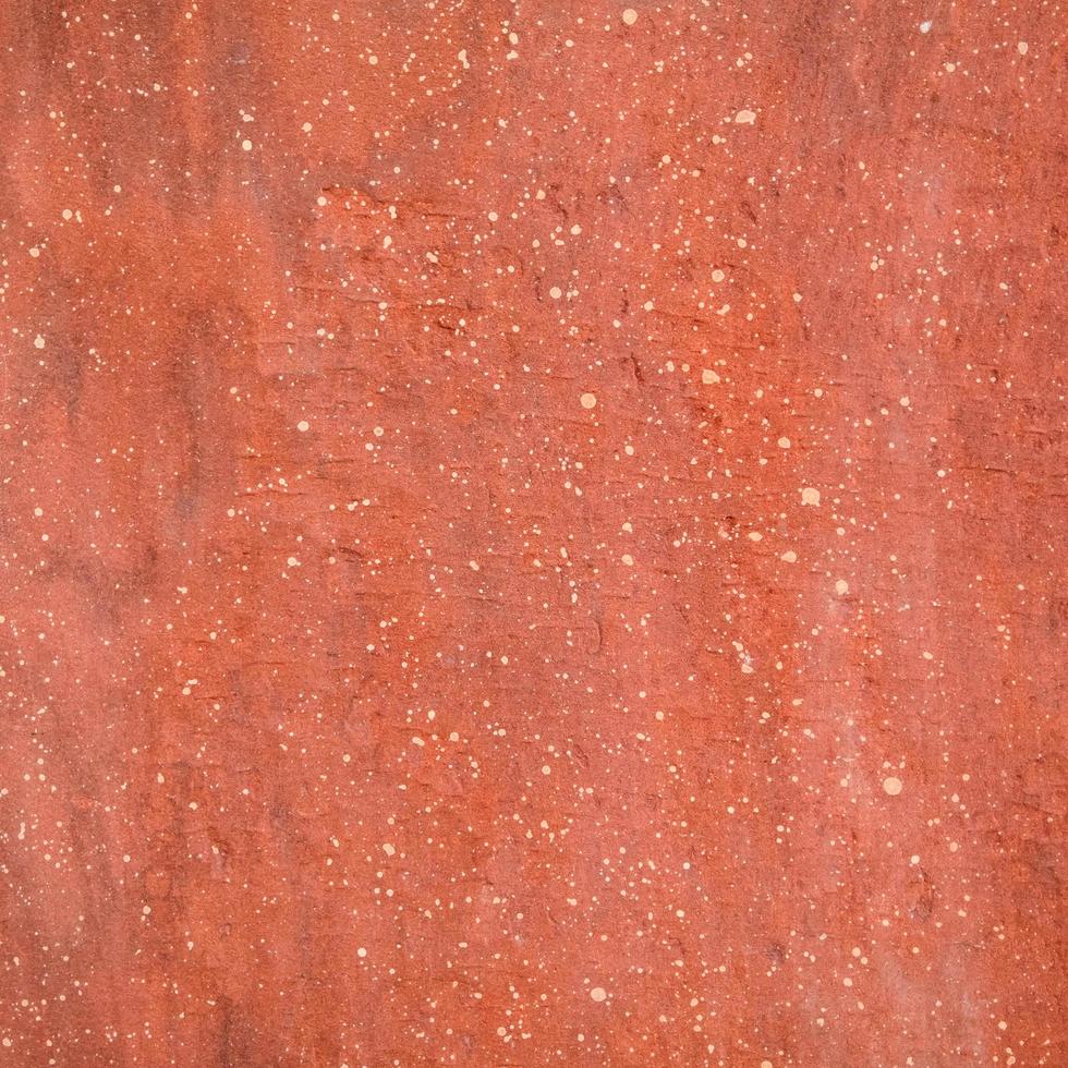 fond de texture de pierre rugueuse rouge. photo