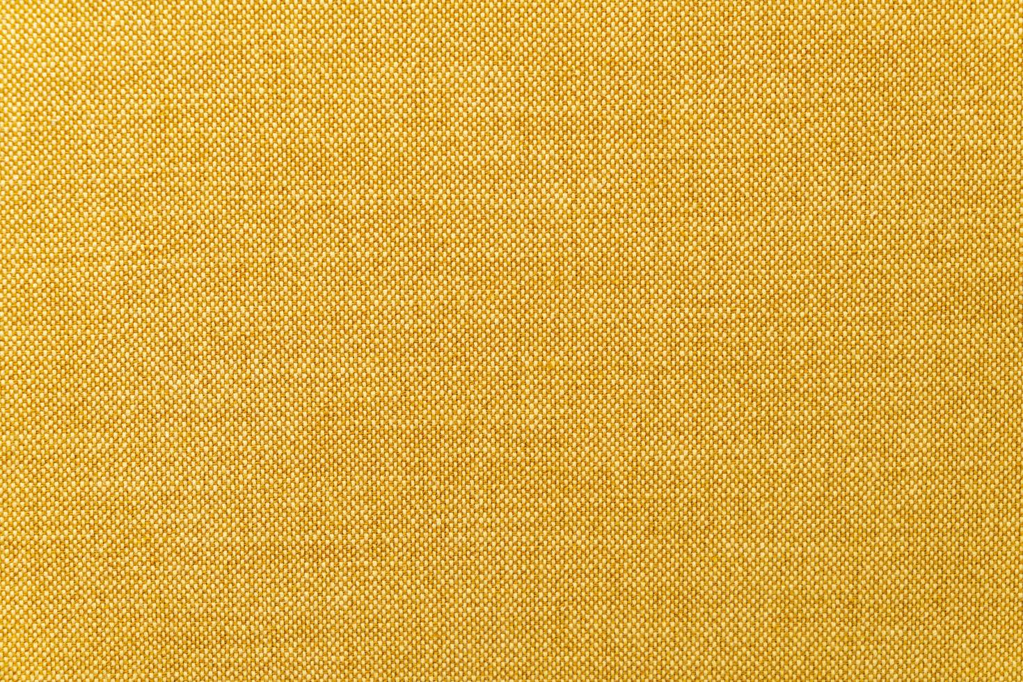 texture de surface en tissu moutarde jaune ou doré en gros plan pour le fond photo