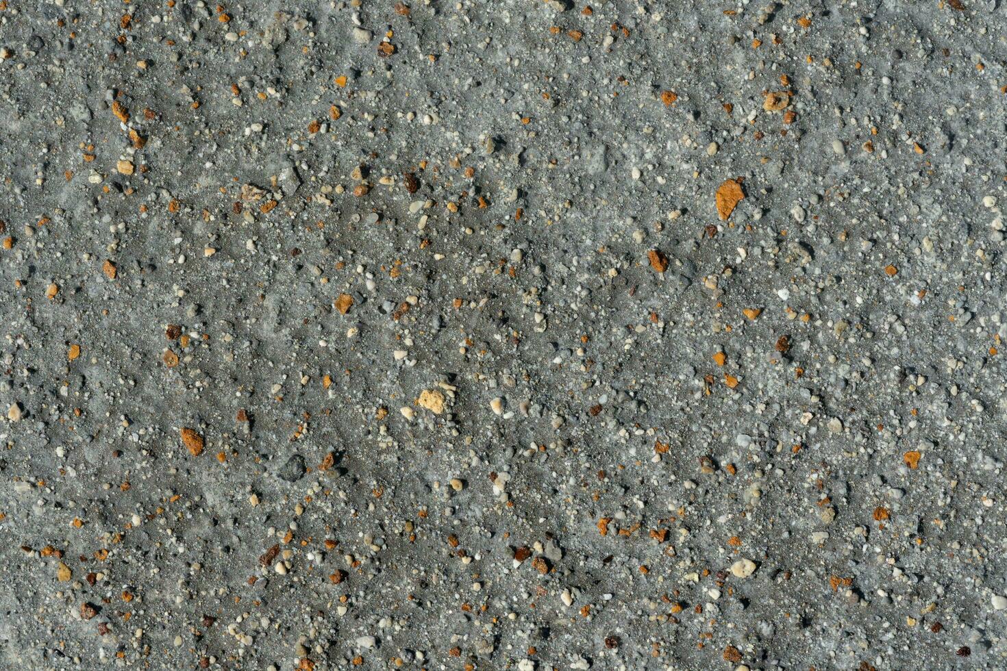 gris volcanique sable, petit coloré pierre surface. Naturel Contexte ou texture photo