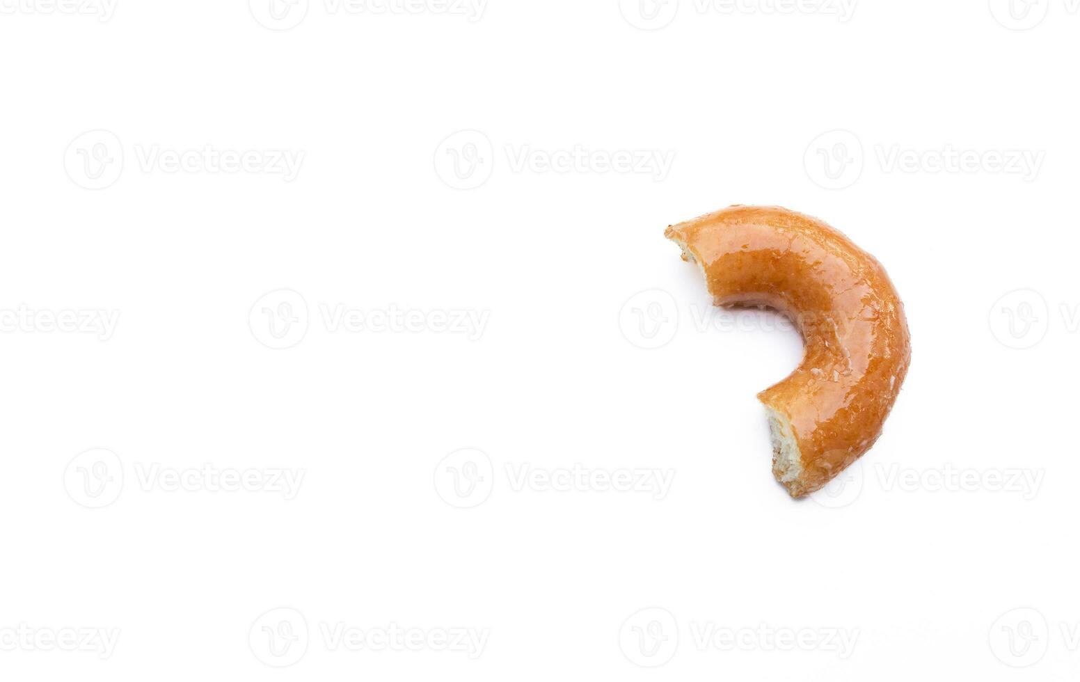 mordu vitré Donut isolé sur blanc Contexte. après certains modifications. photo