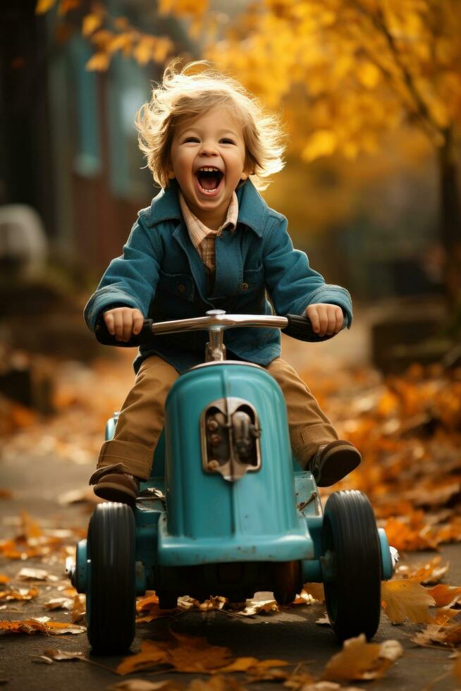 une Jeune enfant équitation une peu voiture par le feuilles dans le tomber photo