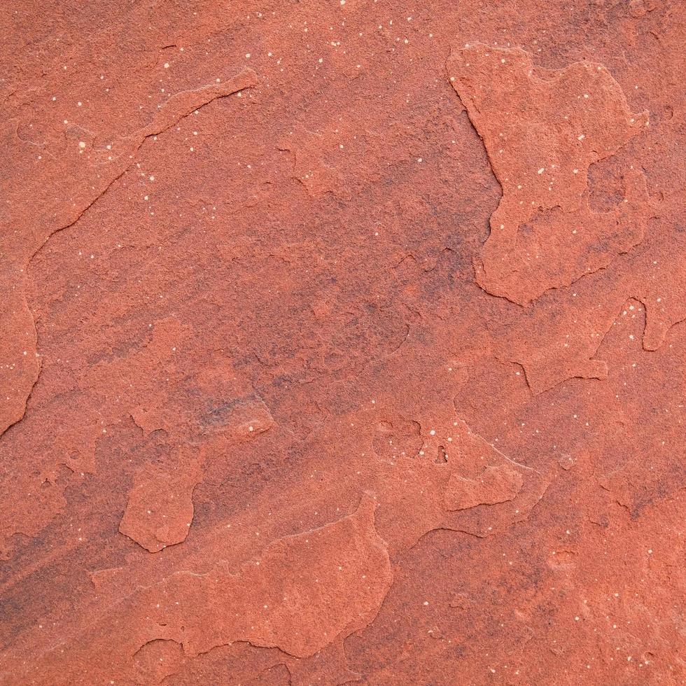 fond de texture de pierre rugueuse rouge. photo