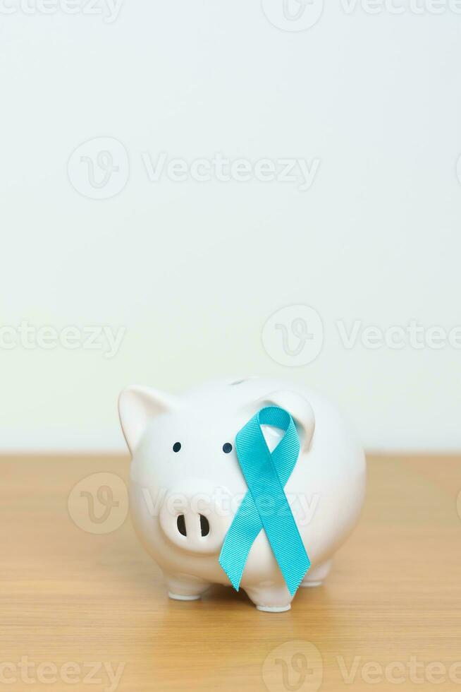 bleu novembre prostate cancer conscience mois, bleu ruban avec porcin banque pour soutien maladies vie. santé, don, charité, campagne, argent économie, fonds, international Hommes, père et Diabète photo