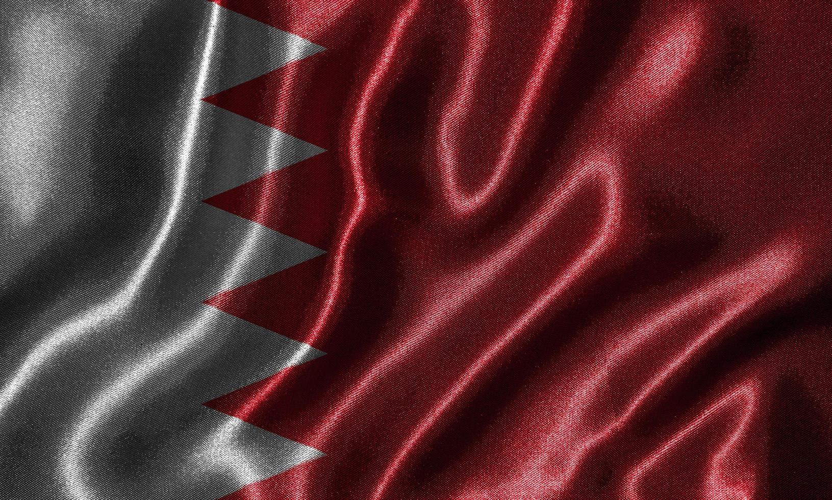 papier peint par drapeau de bahreïn et drapeau ondulant par tissu. photo