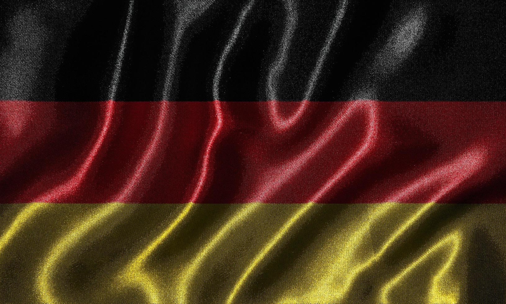 papier peint par drapeau allemand et drapeau ondulant par tissu. photo