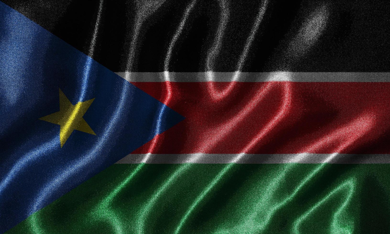 papier peint par drapeau du Soudan du Sud et drapeau ondulant par tissu. photo