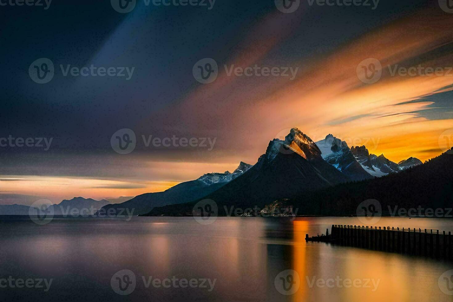 le montagnes sont réfléchi dans le l'eau à le coucher du soleil. généré par ai photo