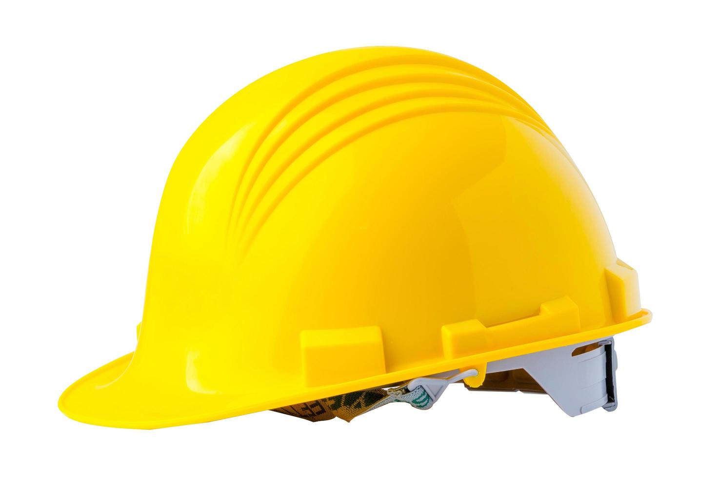 casque de construction jaune avec plan, concept de sécurité de l'ingénieur. photo