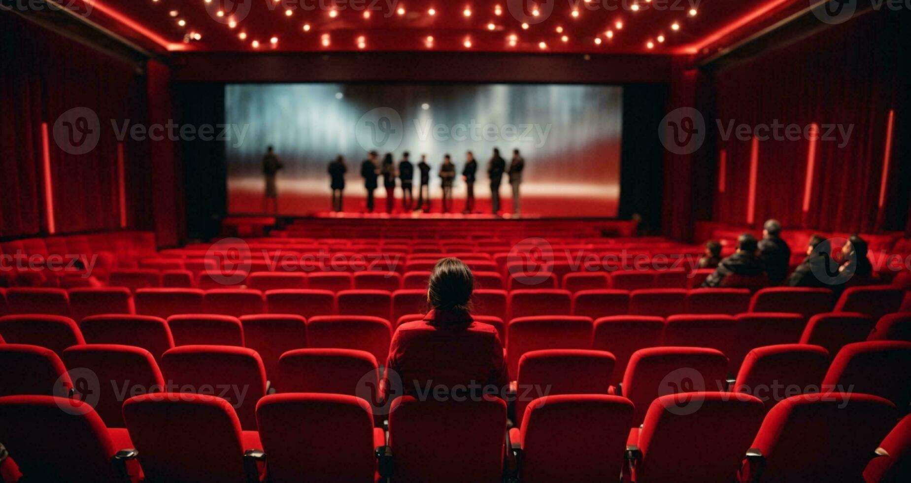 cinéma salle avec rouge des places et projecteur filtrer. retour vue de méconnaissable gens séance dans cinéma salle. ai génératif photo