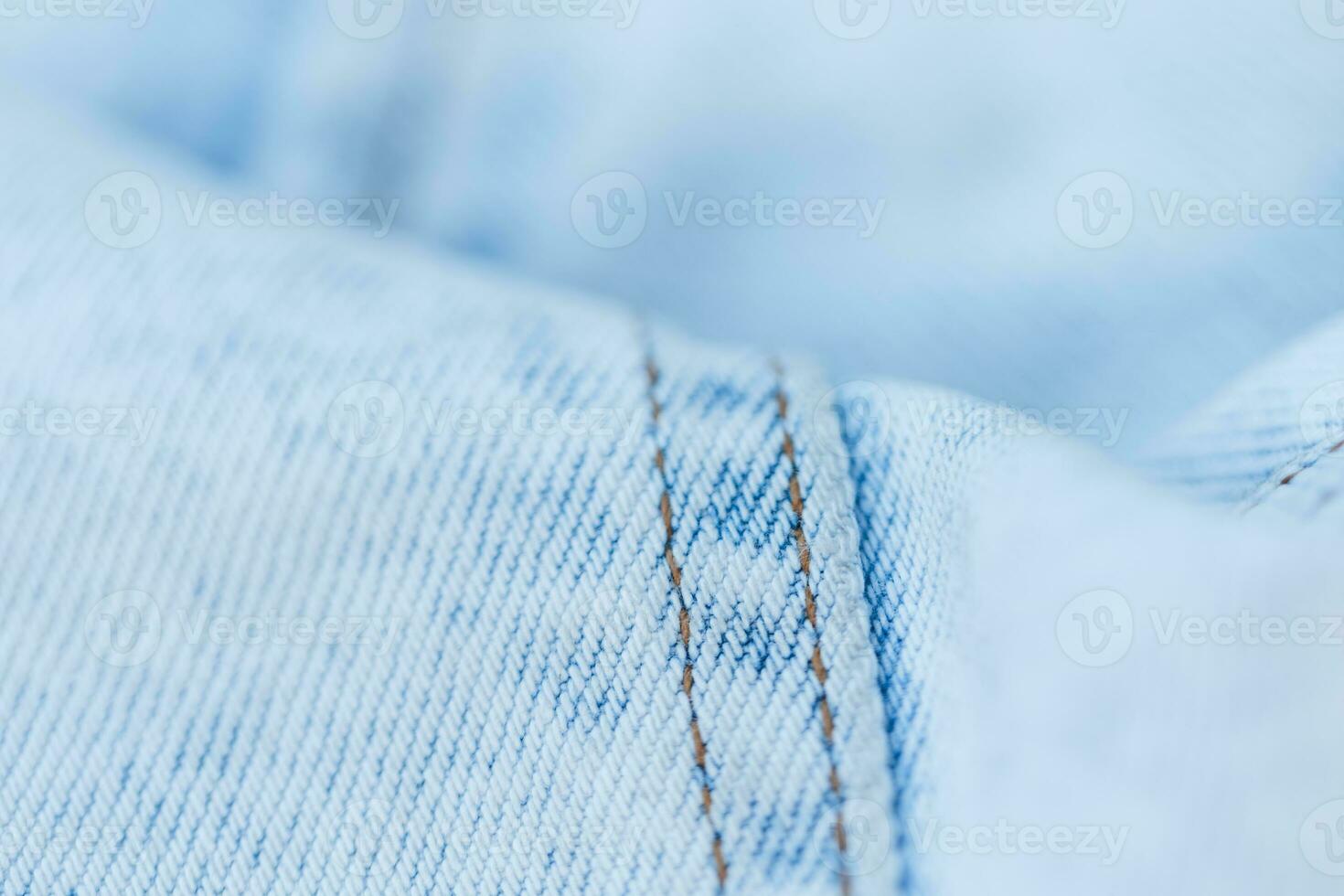 lumière bleu jeans texture, fermer. jeans mode et denim en tissu photo