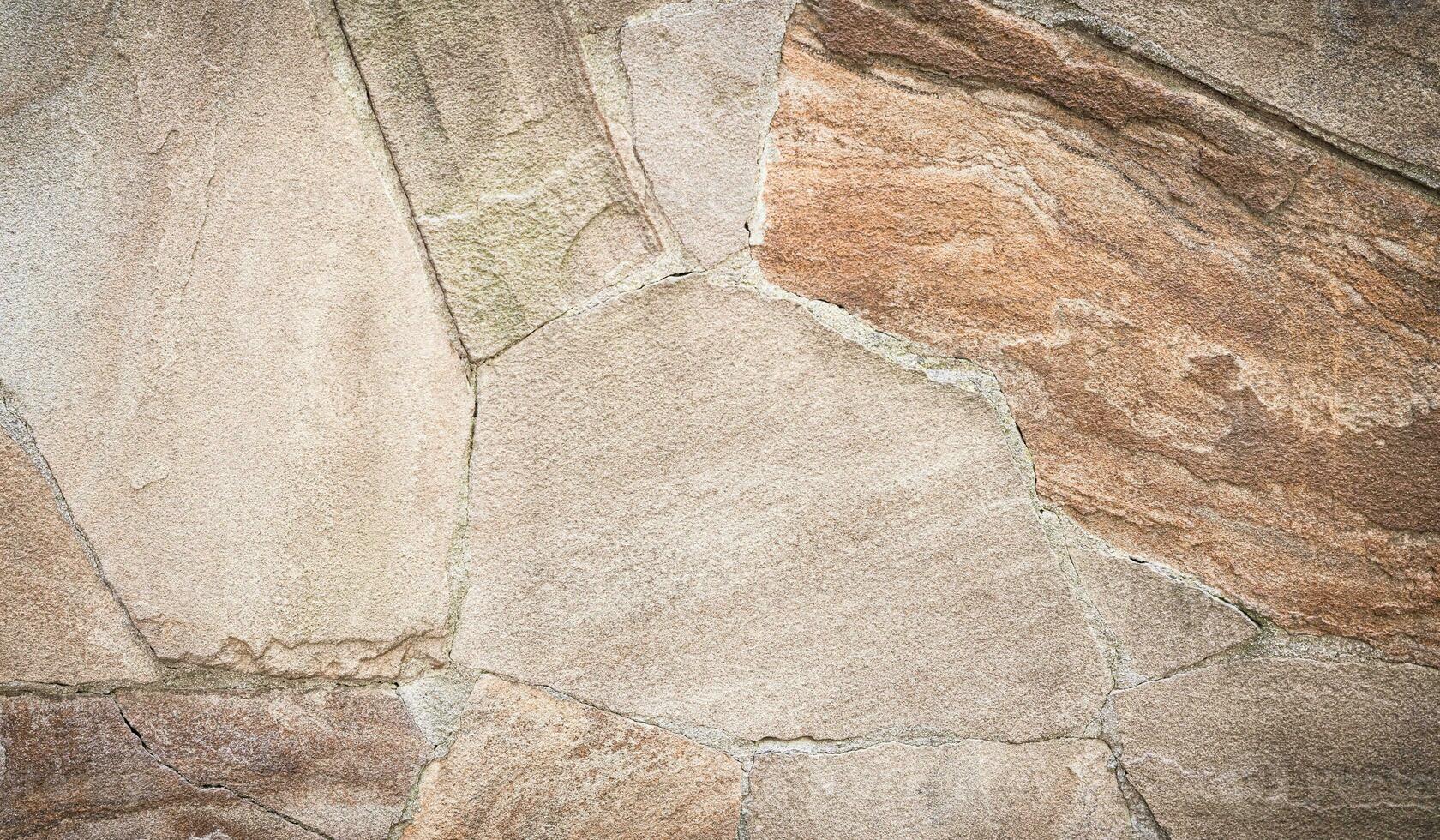 partie de le pierre mur de une bâtiment. Naturel Contexte. sélectif se concentrer. photo