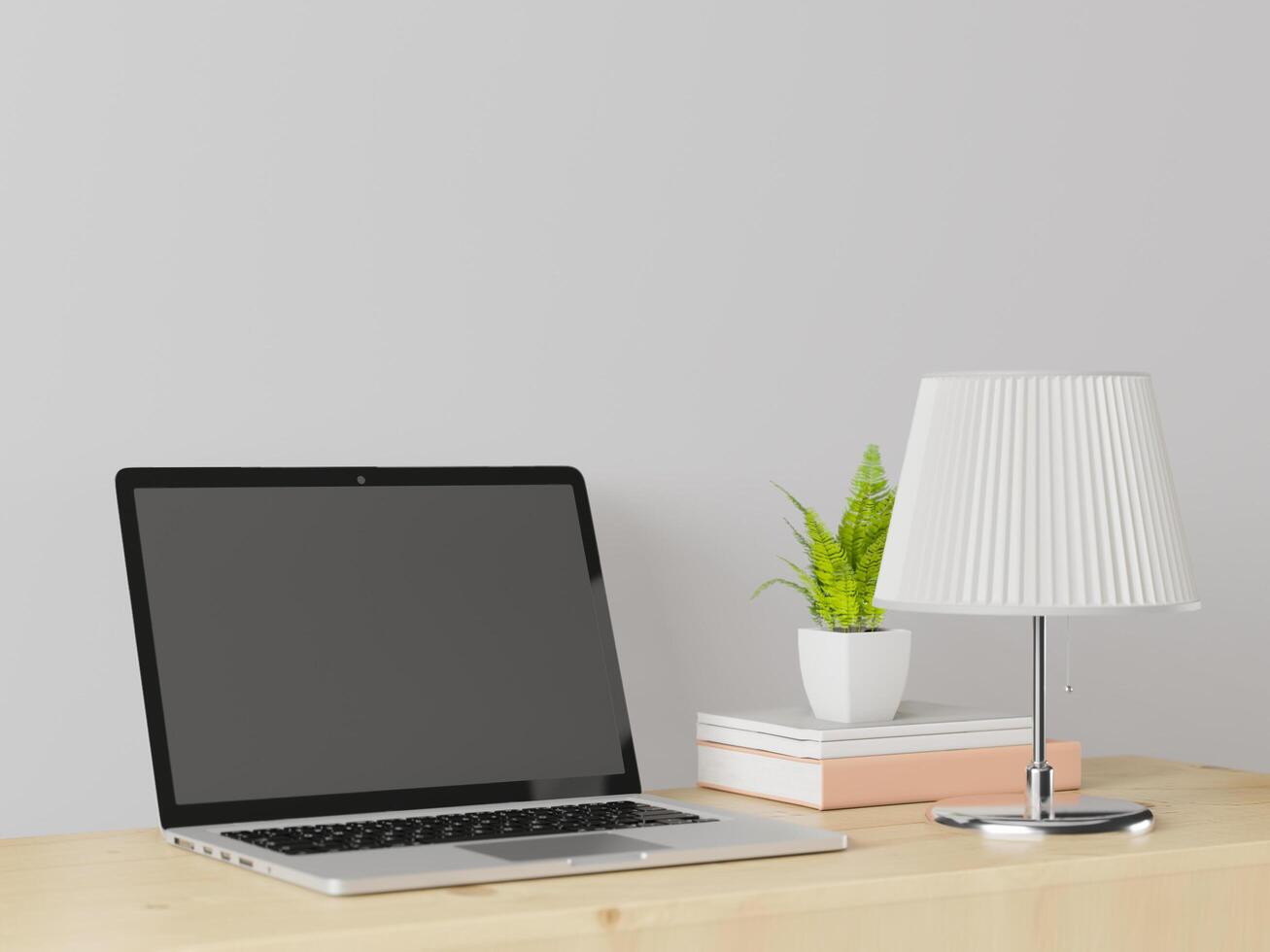 une salle de travail avec un ordinateur portable avec une lampe posée sur la table. photo