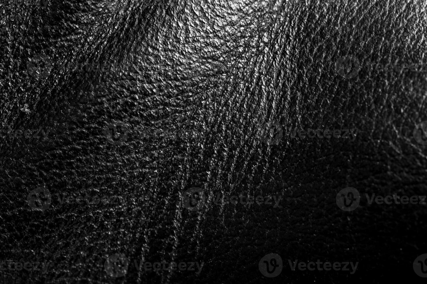 brillant Naturel réel noir cuir avec fléchit foncé vagues Contexte texture abstrait proche en haut, luxe noir vache cuir texture Contexte photo