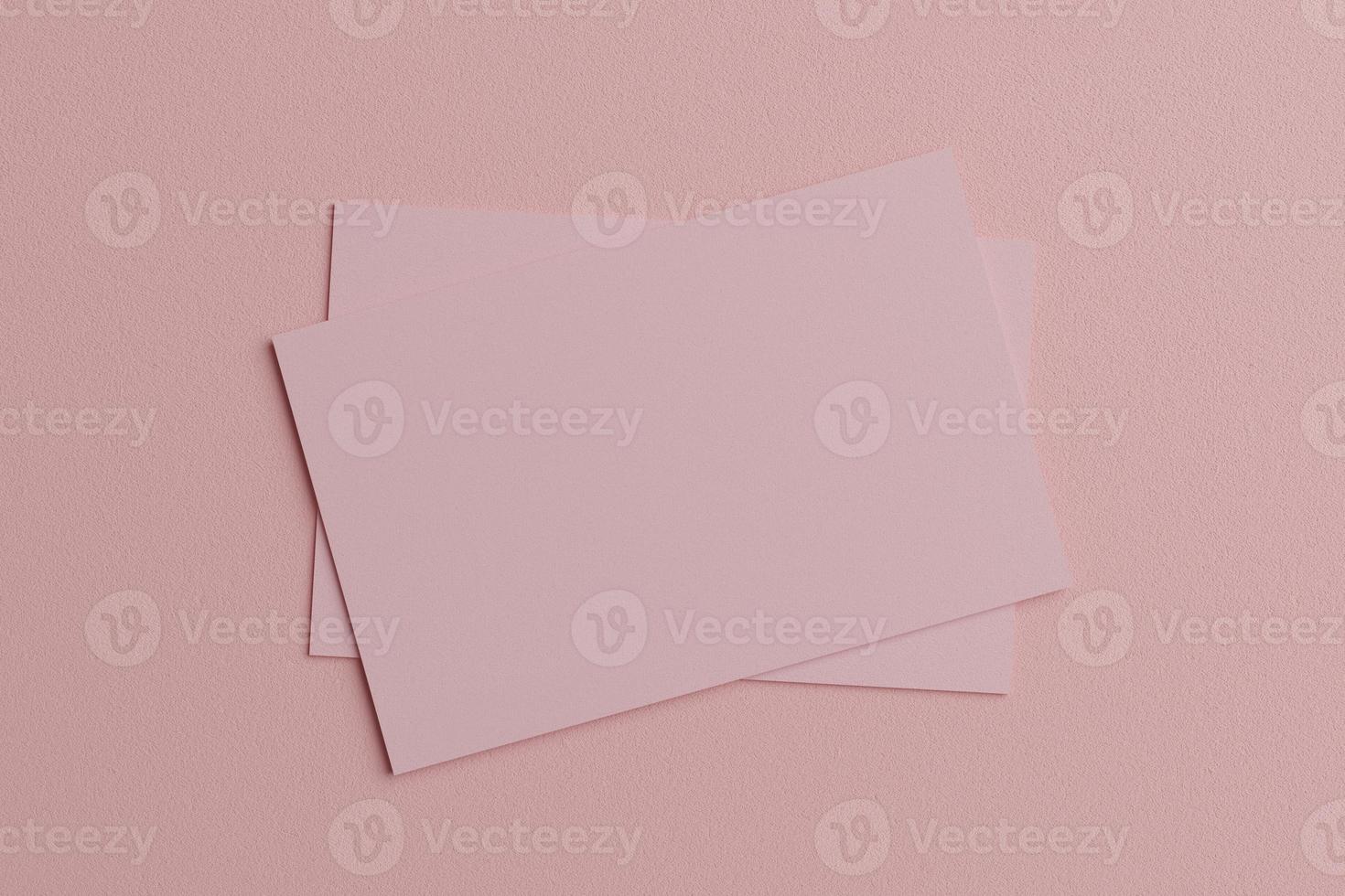 modèle de maquette de papier de carte de visite pastel rose avec couverture d'espace vide pour insérer le logo de l'entreprise ou l'identité personnelle sur fond de carton. concept de style moderne. vue de dessus. rendu d'illustration 3D photo