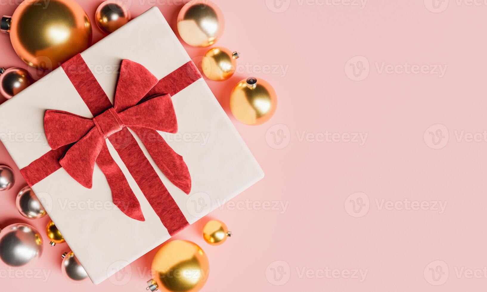 cadeau avec un grand arc et des boules de noël autour photo