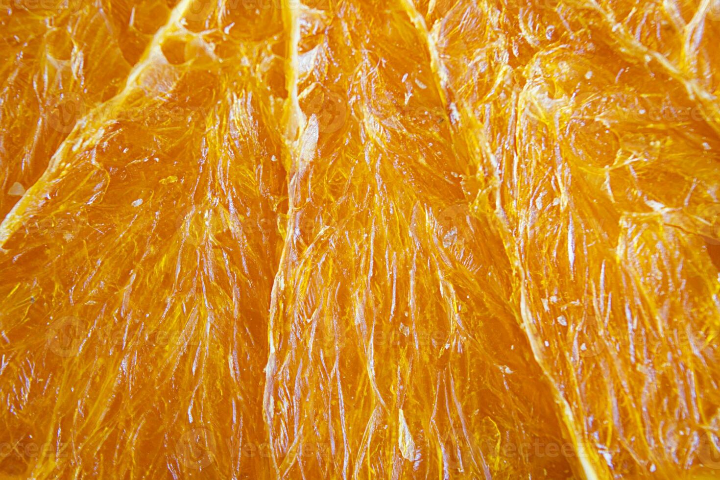 Orange frites texture, macro. fruit puces. une en bonne santé collation. photo