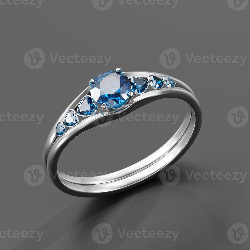 Bague en diamant saphir bleu isolé sur fond de rendu 3D photo
