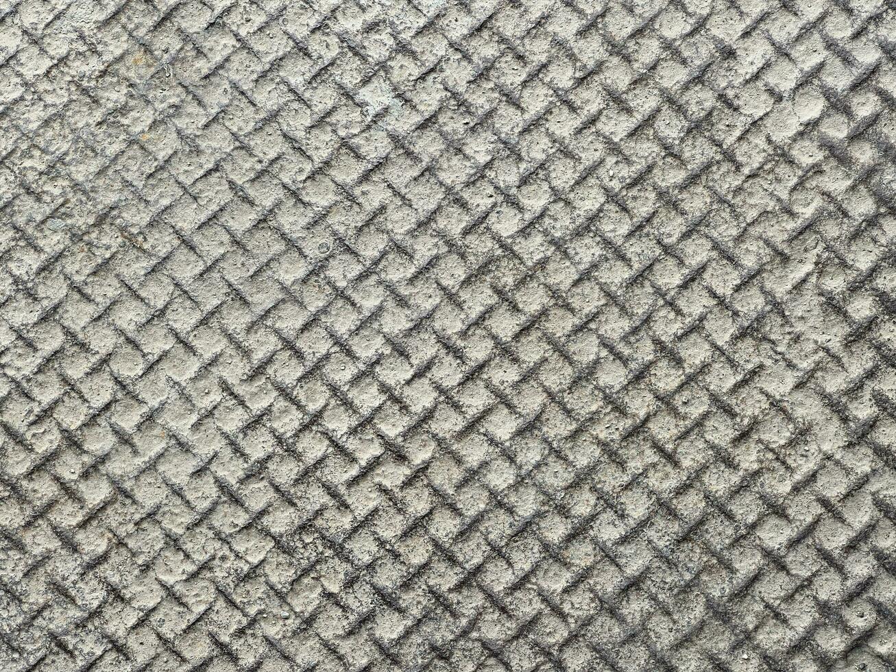 patiné inoxydable acier bande de roulement diamant assiette avec poussière industriel sol photo