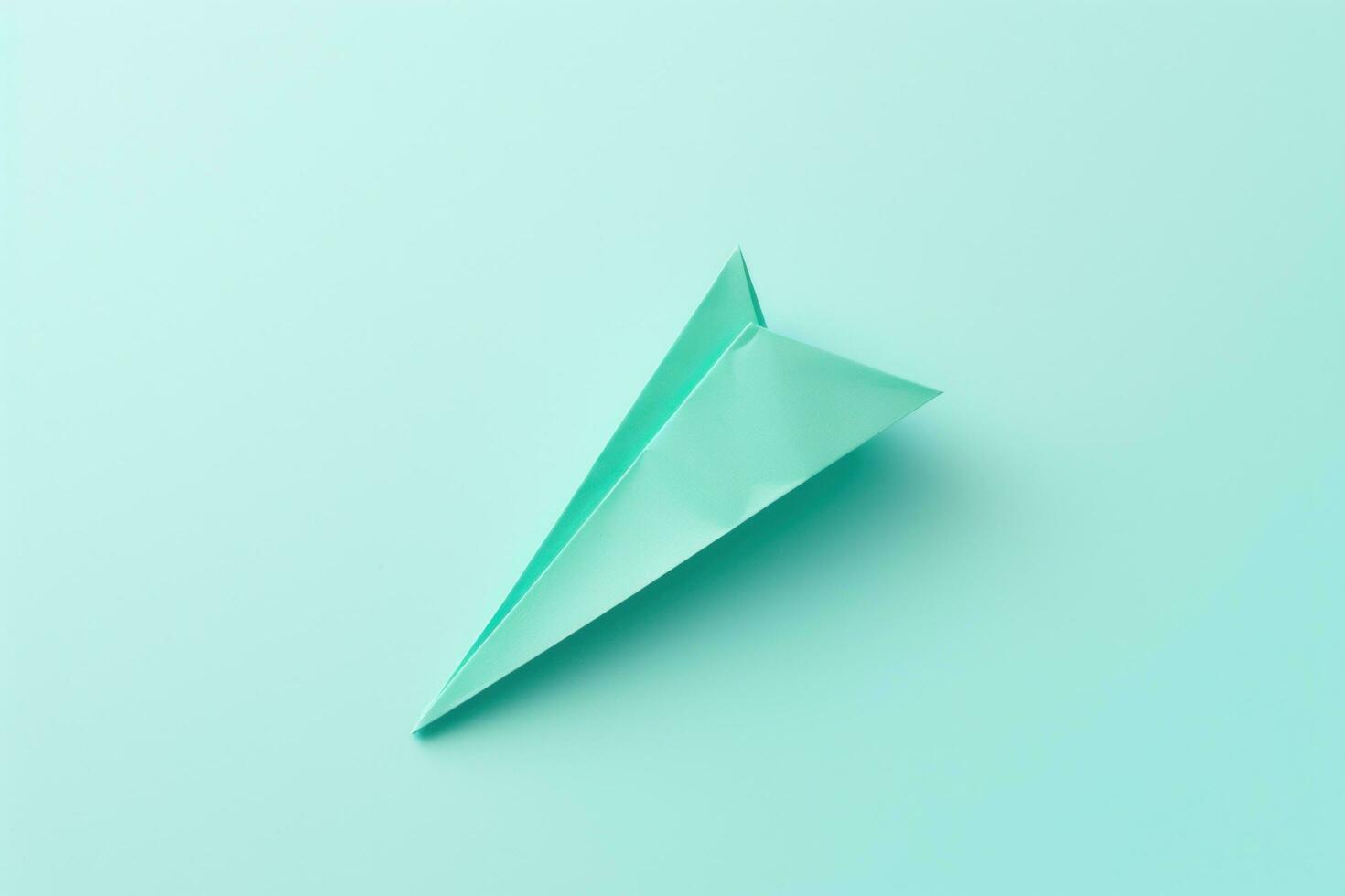 ai généré papier avion isolé sur pâle turquoise photo