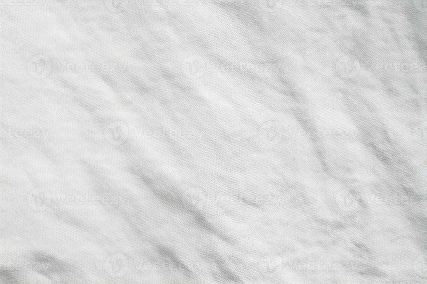 fond de texture de tissu de chemise en coton froissé blanc photo