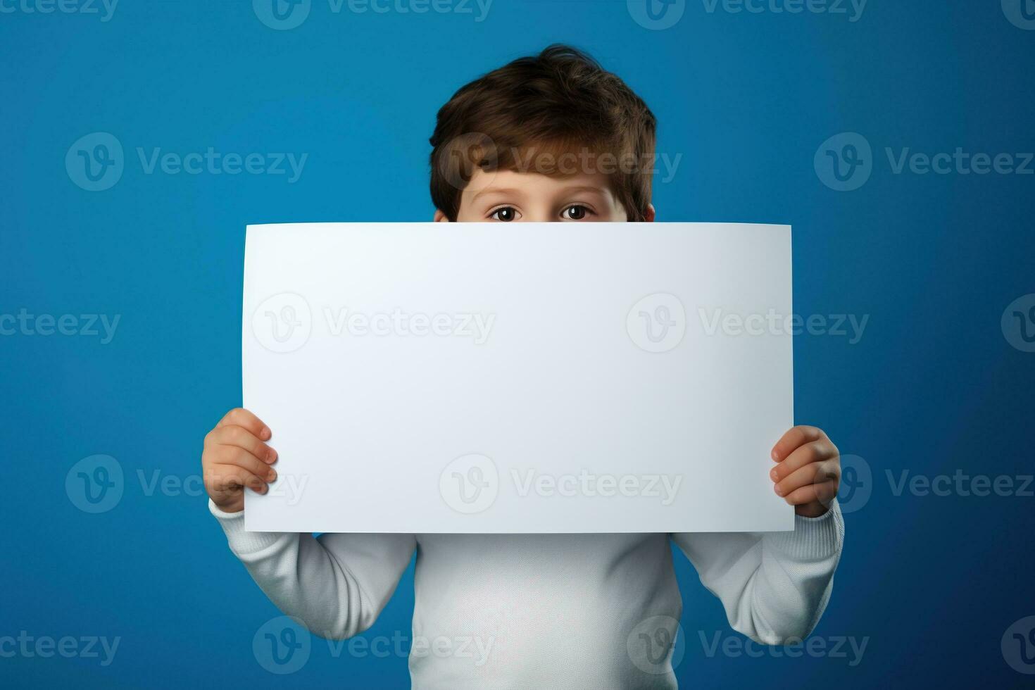 ai généré peu garçon en portant une Vide blanc feuille de papier photo