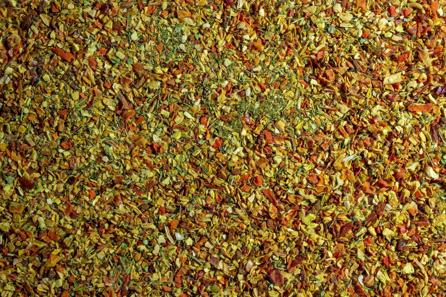 vibrant et coloré légume assaisonnement mélanger. une culinaire Toile de aromatique assaisonnement - texturé Contexte pour gourmet cuisson. le harmonieux combinaison de Frais herbes et épices - Haut vue photo
