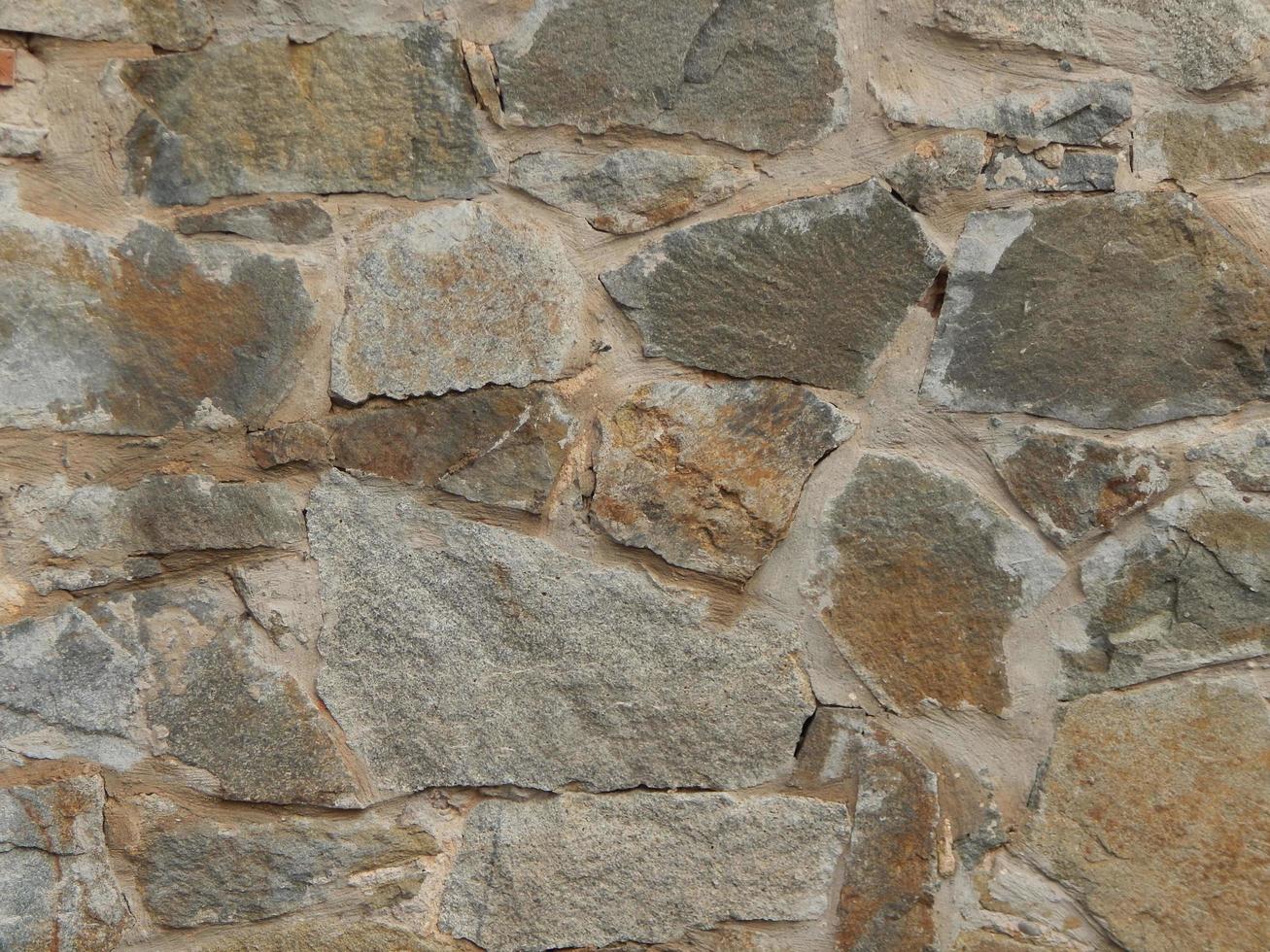 la texture du pavage et des murs en pierre et en brique photo