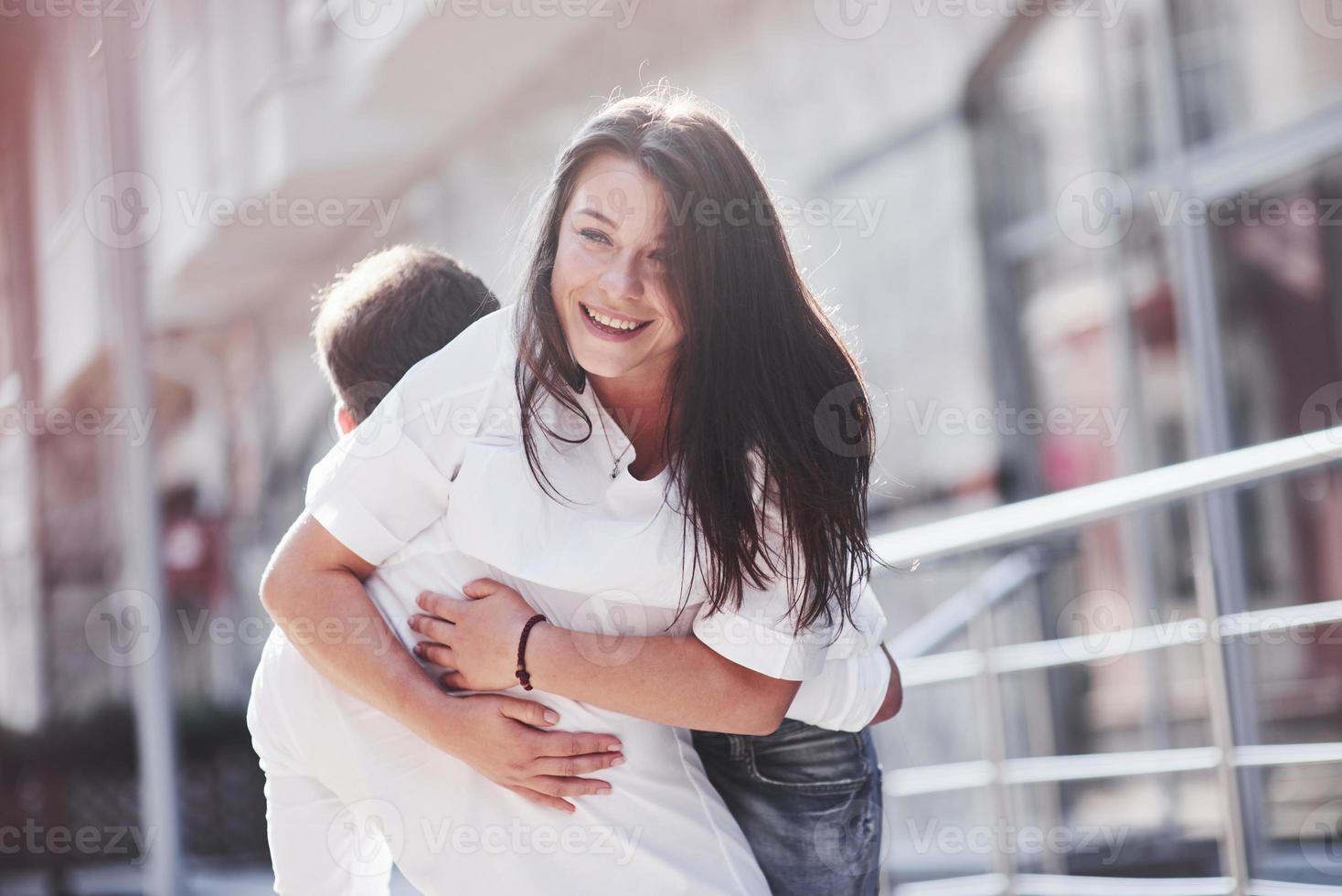 Beautiful happy couple hugging on the city street.lifestyle concept love and romance photo