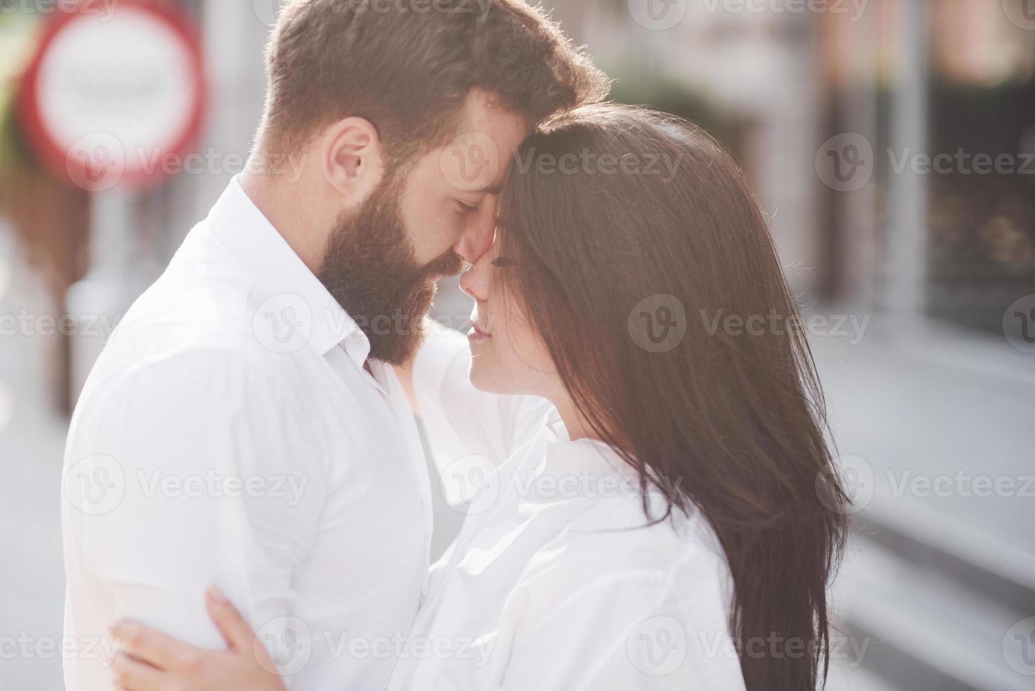 Beautiful happy couple hugging on the city street.lifestyle concept love and romance photo