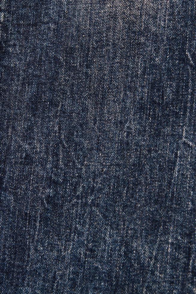 gros plan de tissu denim, gros plan de texture jeans foncé photo