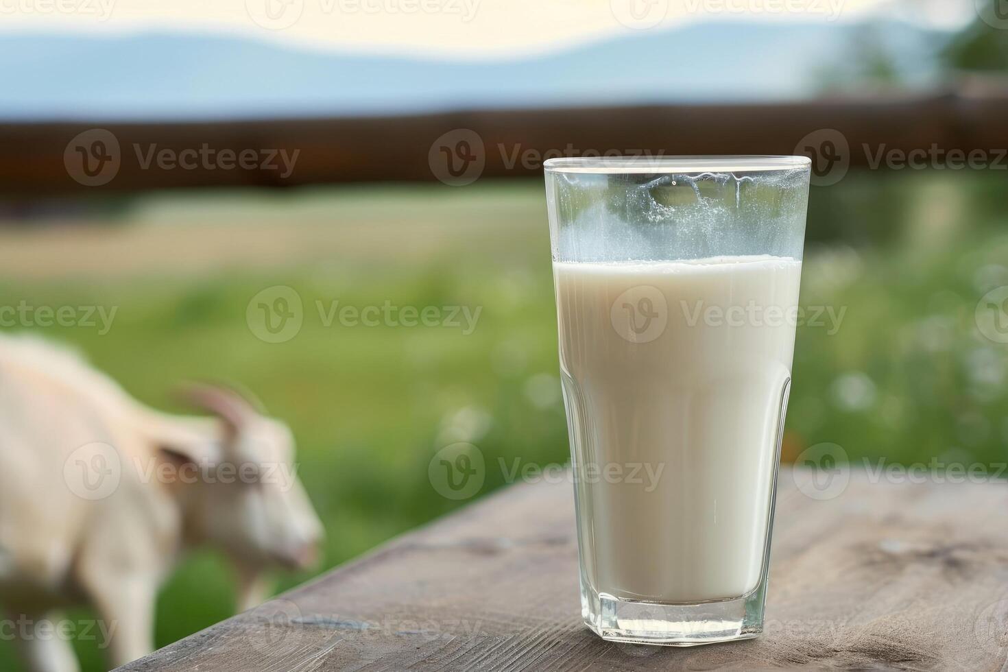 ai généré verre de Naturel Frais Lait sur table avec chèvre et vert champ ferme paysage voir. photo