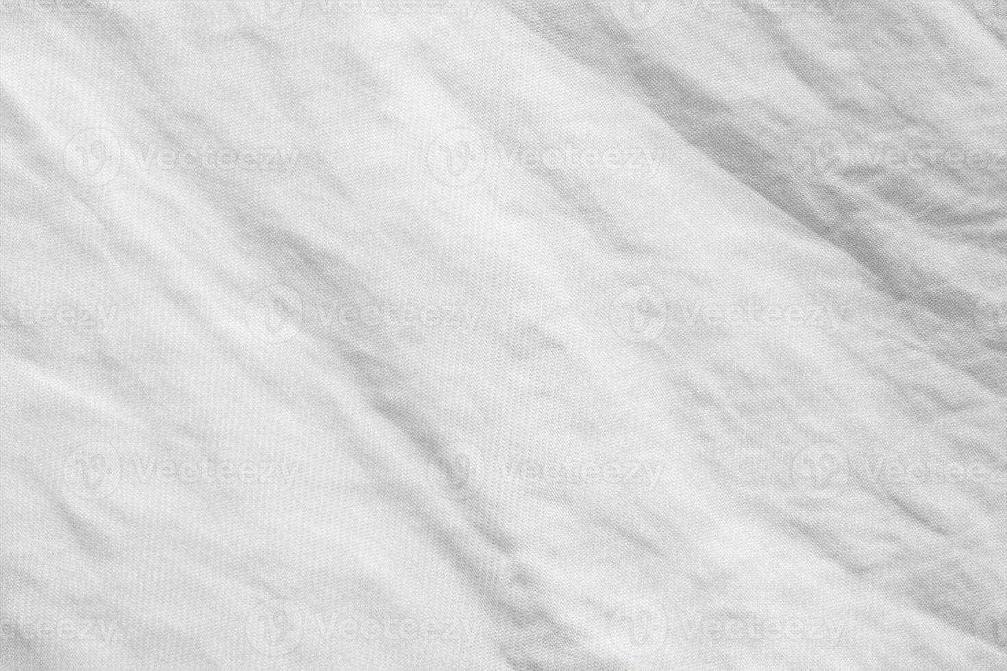 fond de texture de tissu de chemise en coton froissé blanc photo