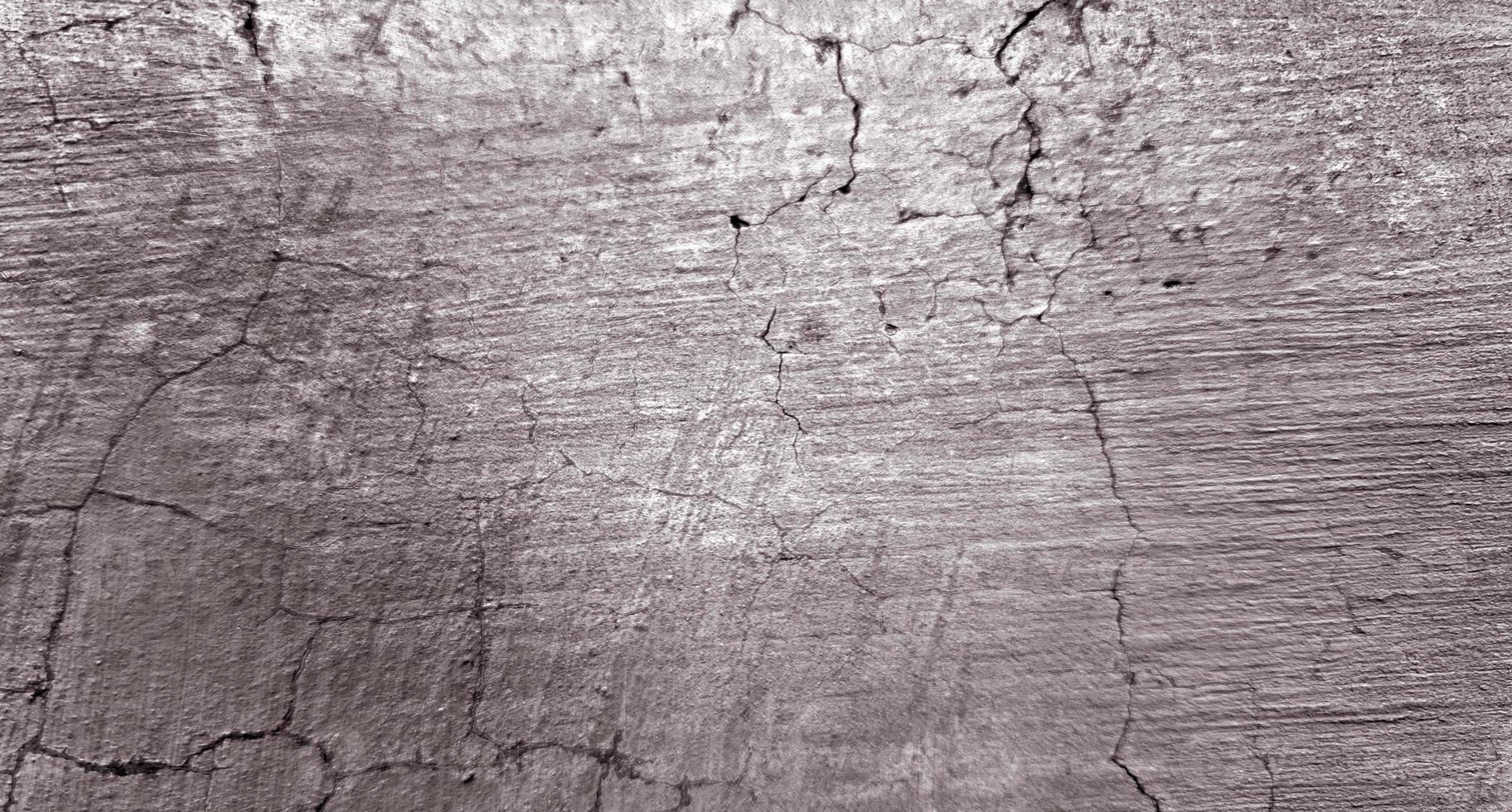 texture de ciment fissuré gris pour le fond photo