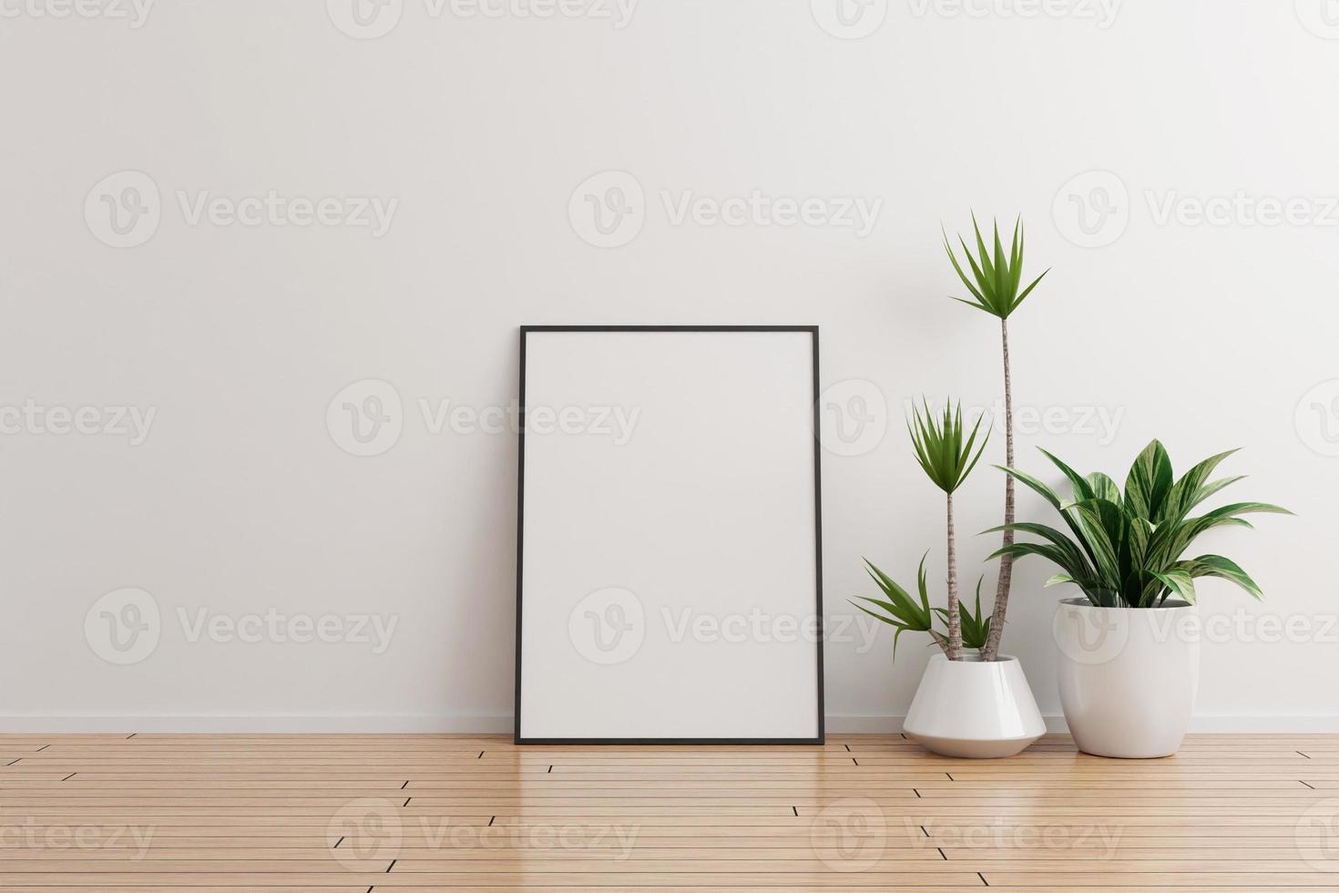 maquette de cadre photo vertical noir sur un mur blanc pièce vide avec des plantes sur un plancher en bois