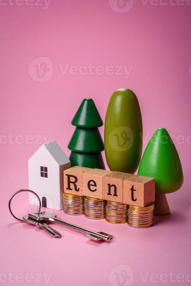 petit en bois maison et le une inscription pour louer. concept pour vente, de location de réel biens pour une famille photo