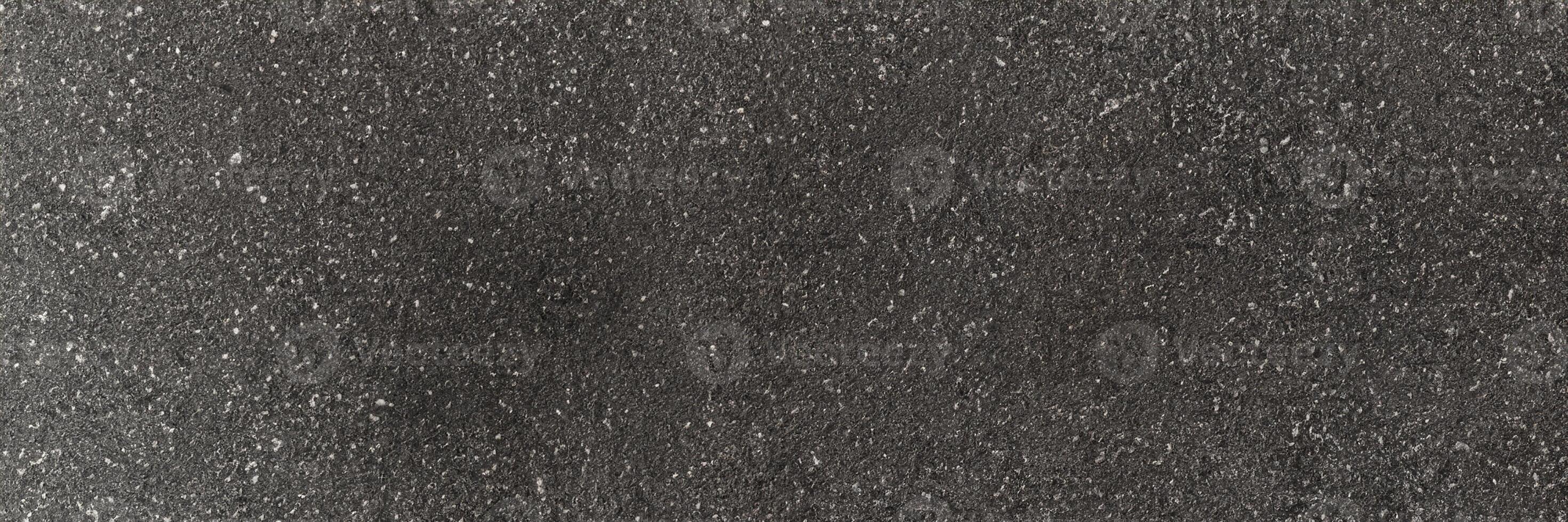 panorama noir asphalte route texture et Contexte. horizontal macadam gris granuleux sur asphalte route. photo