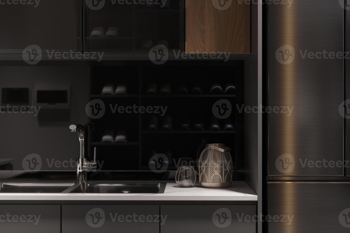 une compact cuisine avec noir armoires et blanc compteur hauts. photo
