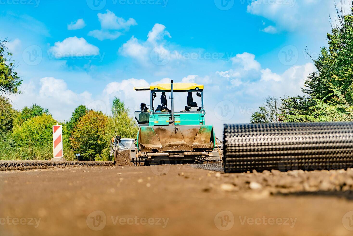 lourd devoir route bâtiment. route construction équipement pour le construction de routes photo