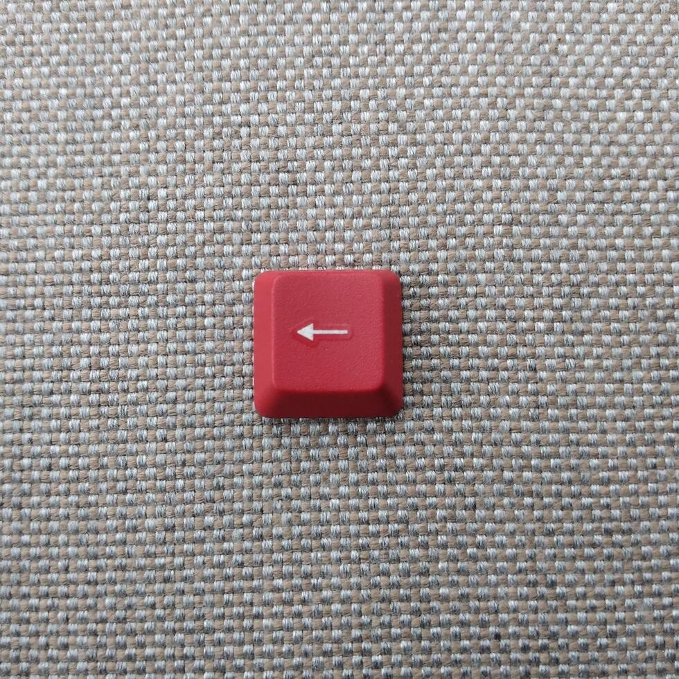 clavier rouge bouton sur gris texturé Contexte photo
