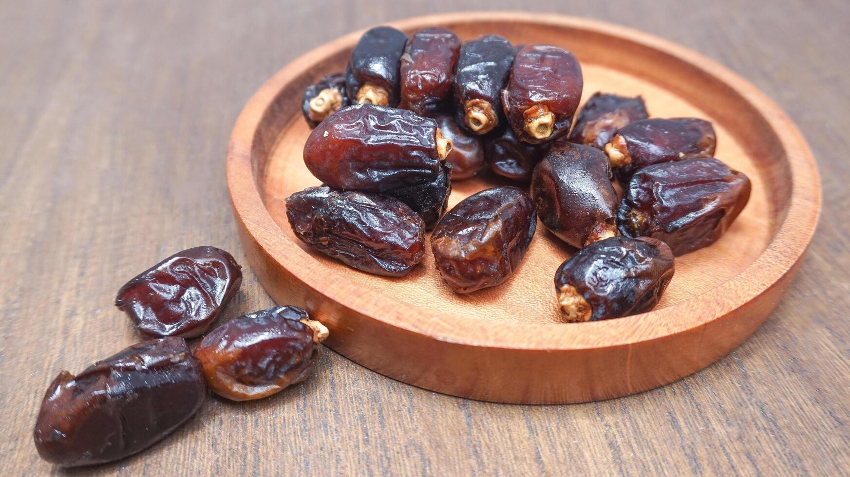 fermer sucré séché Date paume des fruits ou Kurma, Ramadan nourriture photo