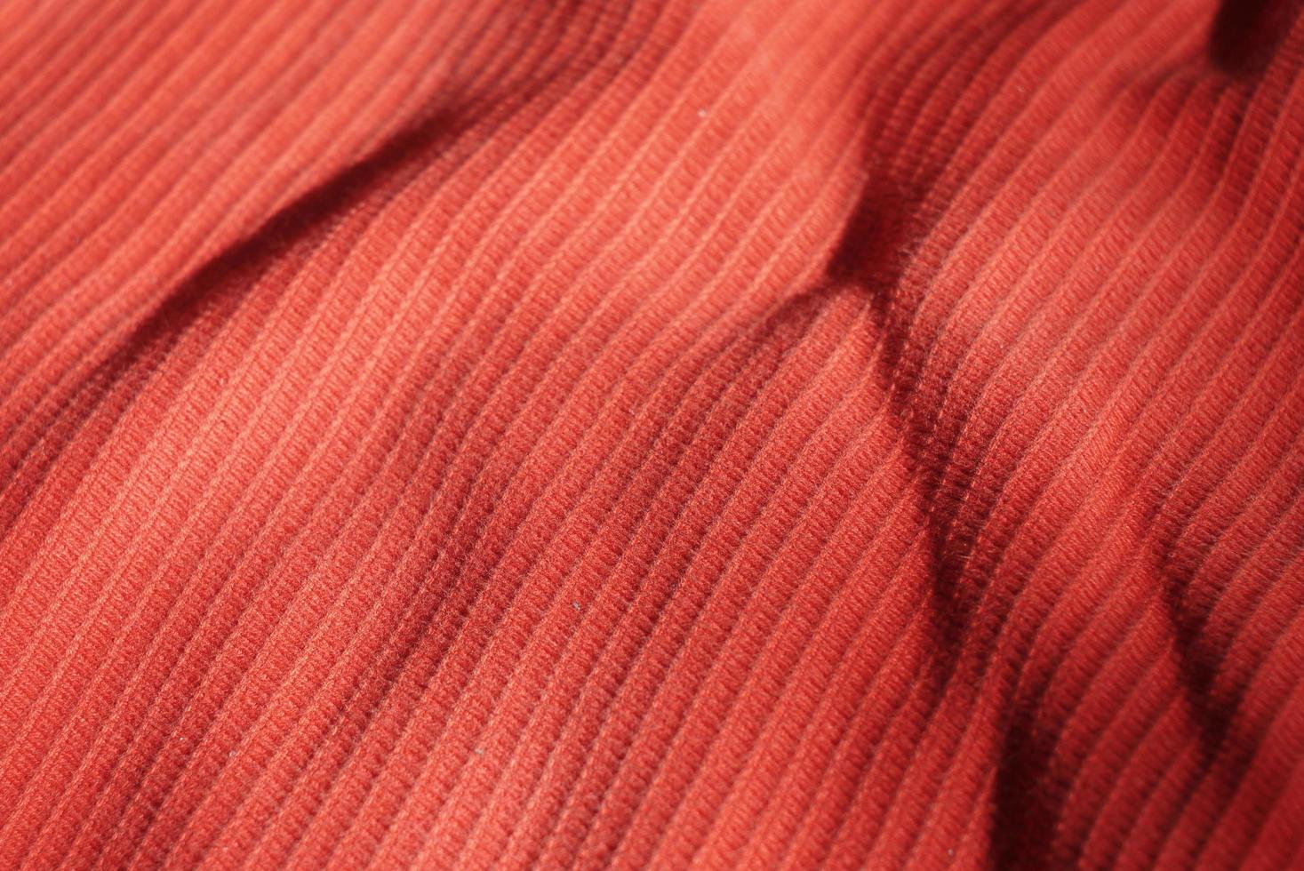 fond de matériau rouge. fond de tissu rouge vif. photo