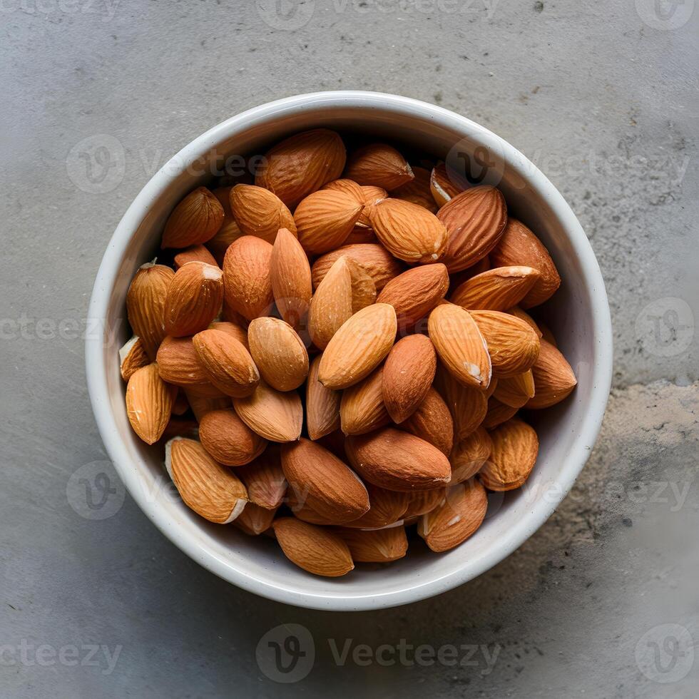 ai généré biologique amandes dans céramique bol Naturel casse-croûte sur béton Contexte pour social médias Publier Taille photo