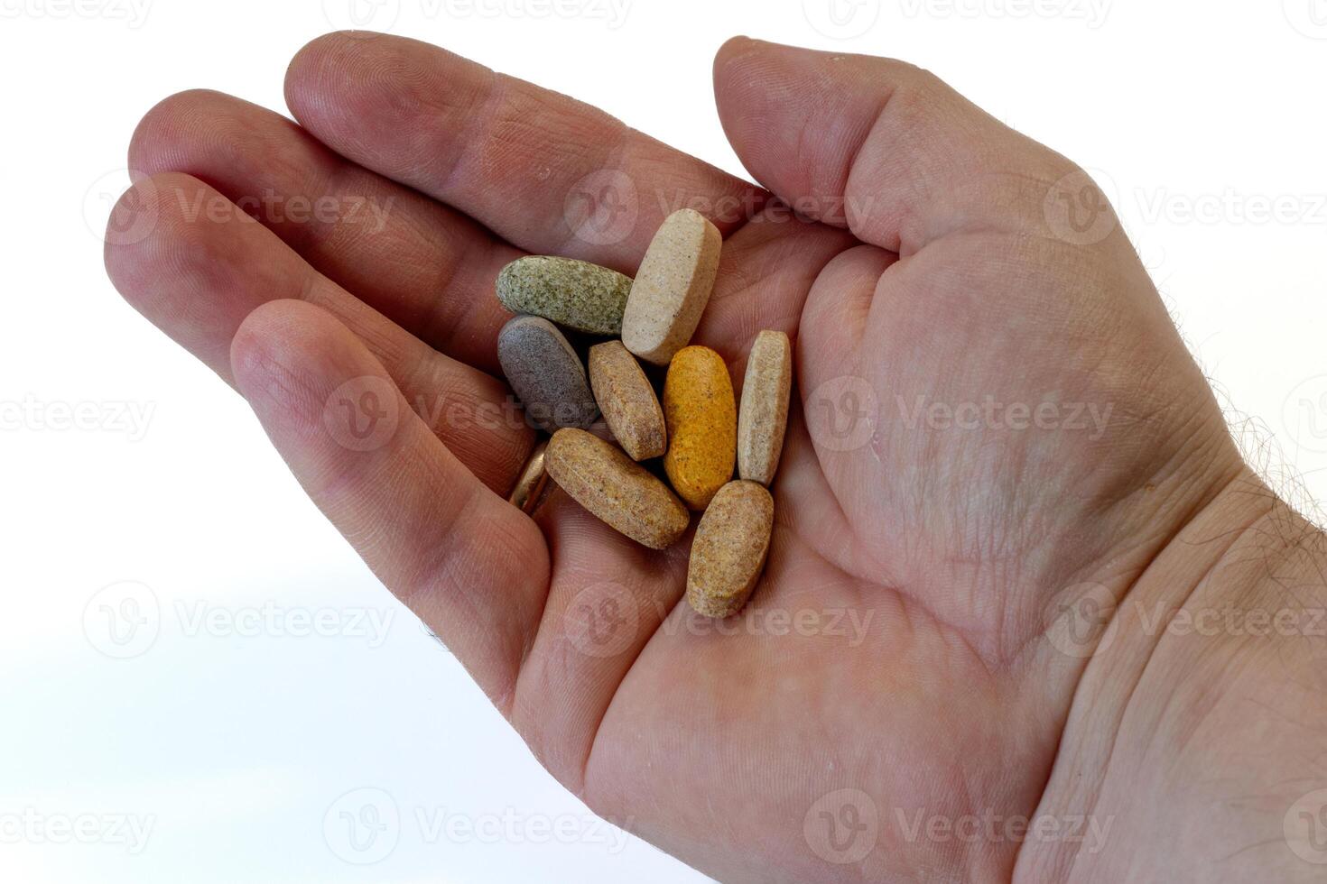 une portion de une diététique supplément de vitamines dans main photo