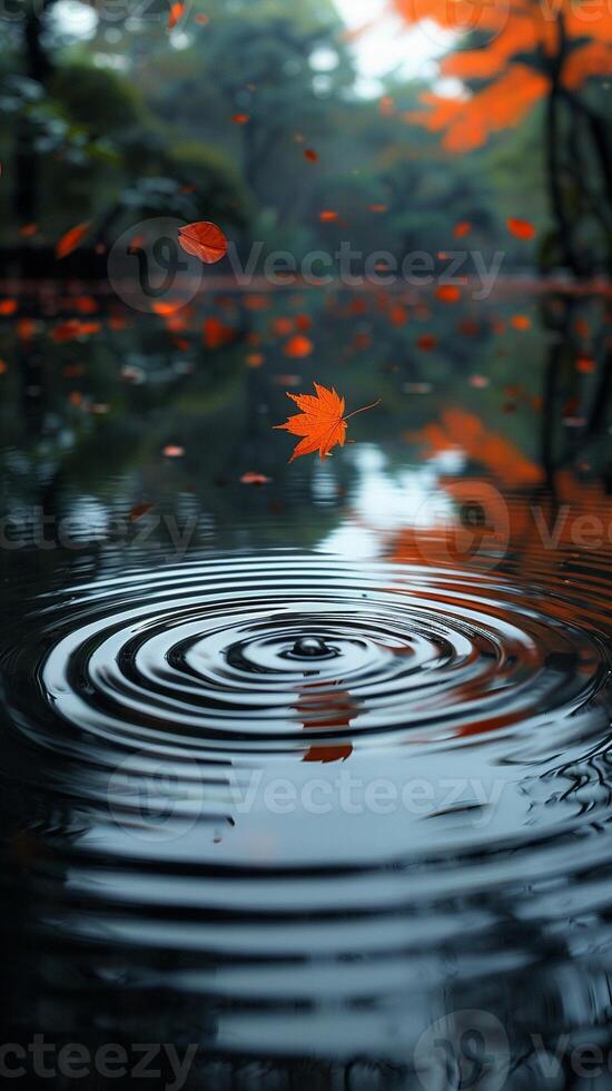 ai généré ondulations sur une serein étang surface touché par chute l'automne feuilles photo