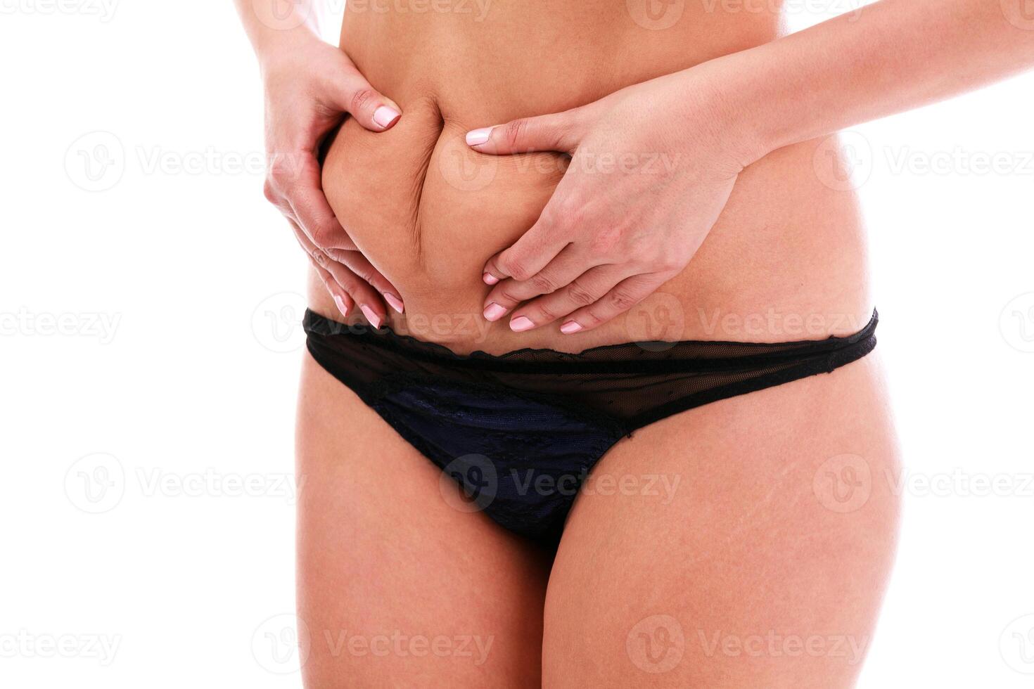 femme pincements graisse sur sa ventre photo